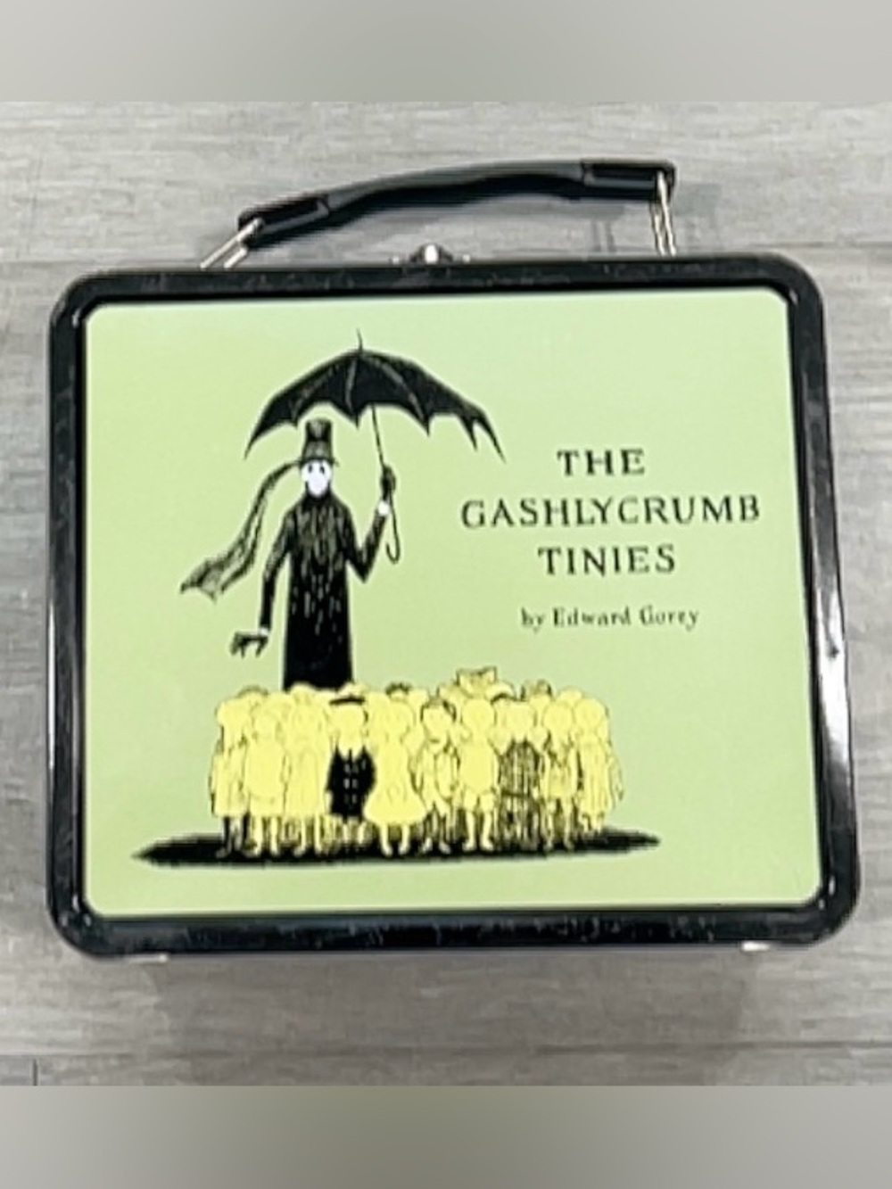 The Gashlycrumb Tinies Tin Lunchbox - Pale Green with Yellow Illustration